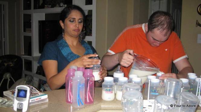 We created an assembly line.  Here George is filling bottles and Neha is capping them.  