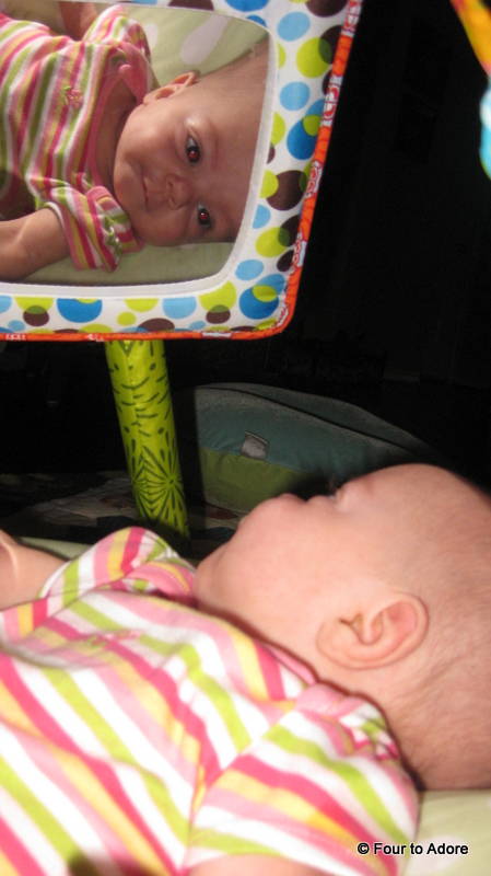 Sydney stopped looking at the tree when she caught a glimpse of her own precious face in the mirror.  