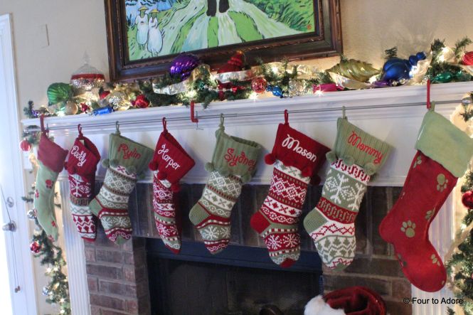 A year ago I never would hava imagined we would have EIGHT stockings hanging along our mantle.  We used a curtain rod and brackets to hand them instead of stocking holders.  It worked great for so many stokings.  
