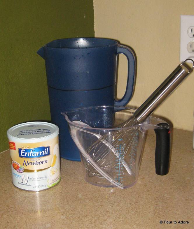 This is what we use to make our batches of formula: gallon sized pitcher, quart sized measuring cup, large whisk, and can of formula.