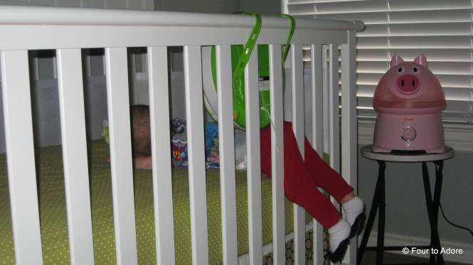 Here's proof that Sydney can roll over.  She's been rolling over and getting her legs stuck between the rails.  Yes, she is sleeping here and no I did not move her (she seemed totally comfortable).