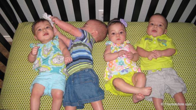 i lined the babies up in birth order for their monthly birthday picture.  This is what happened.  