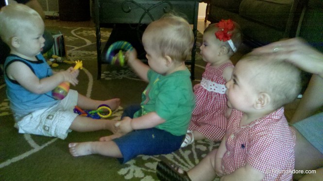 There were four babies at the party, but only two were mine!  Rylin got her first kiss from the adorable little blonde.  Actually, I think Harper also received a kiss from this kiddo.  Hmm.