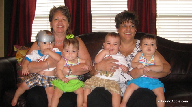 Eileen is holding Mason and Sydney while Marrianne has Harper and Rylin.