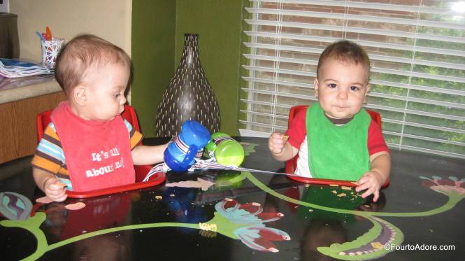 The blue cup is Harper's.  Mason attempted to commandeer it, but it didn't quite reach his lips.  It looks like the Sippy cup straps solve another problem for me.
