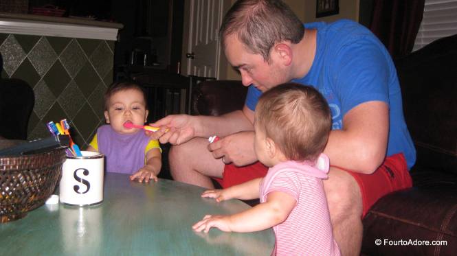 We brush the babies teeth first to ensure the job is sufficiently done.  