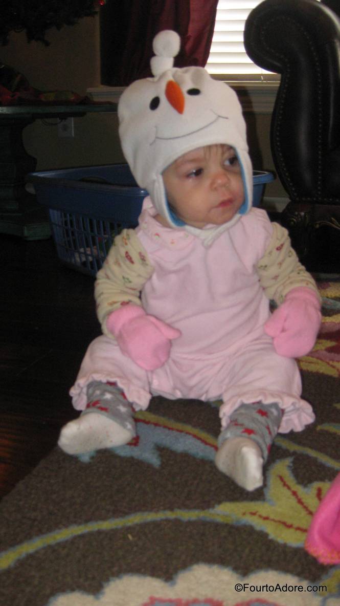 Everyone was already wearing a romper and socks.  I put a pair of Baby Legs under their romper and on their amrs, then I added hats, and fleece pajamas.  Bam! Texas style baby snow suits.  The best part was not dealing with shoes.