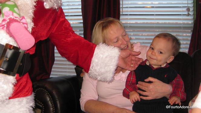 Santa couldn't help but pinch Mason's adorable cheeks.  
