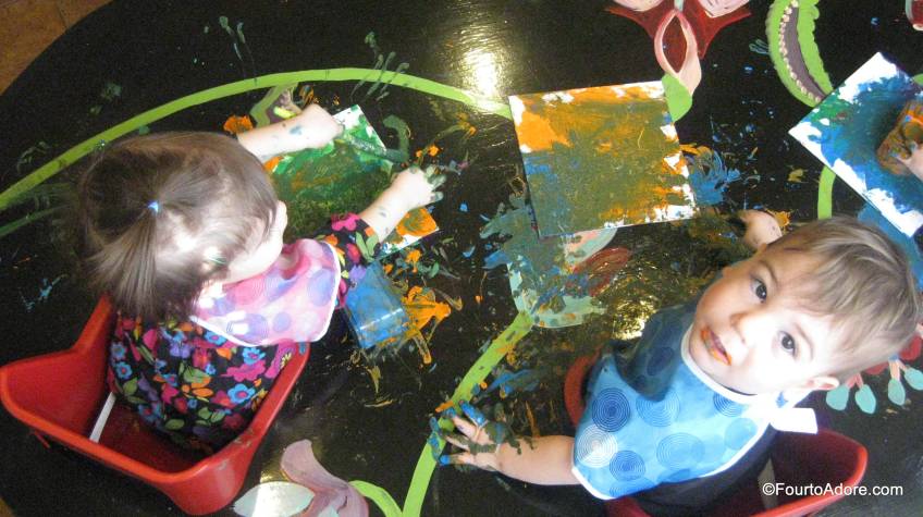 It didn't take long before babies started "borrowing" paint from each other, creating some uniuqe color palates.  You may notice they not only painted their canvases and the table, but also their hair! 