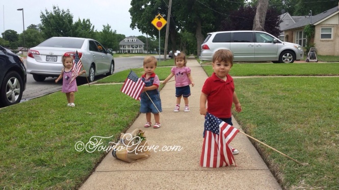 I managed to pull four patriotic looking outfits from the quad's closets.  The previous homeowner left behind four small flags so we had an impromptu parade.  
