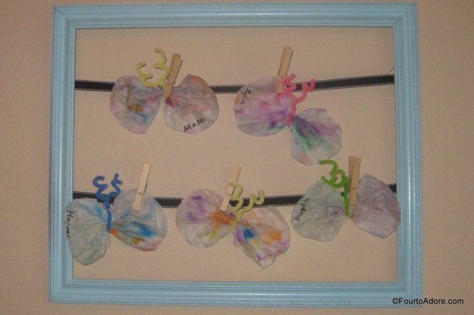 Simple toddler craft: coffee filter butterflies.  Scribble on coffee filters with washable marker, spray with water, allow filter to dry then pinch together with a pipe cleaner. 