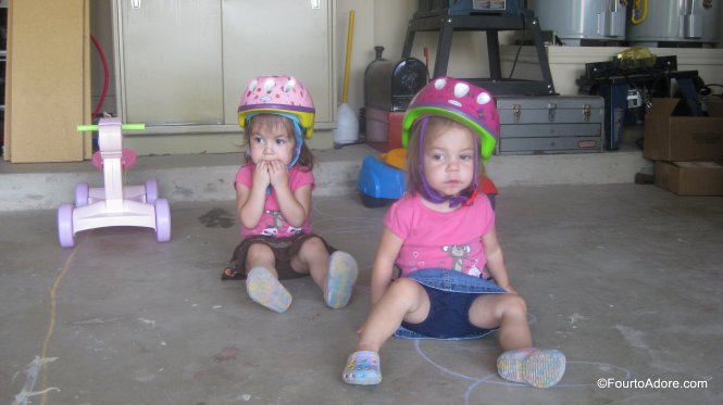 These two ladies cheered on their brothers during the riding toy races. 