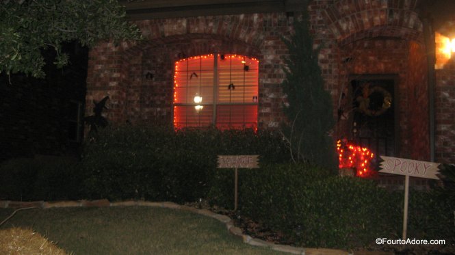 fall porch decor: orange lights plastic bats
