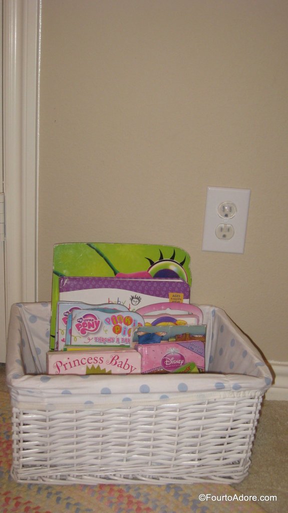 A basket of books has always been part of the girls room.  They seem to relax from "reading" before bed, much like me.