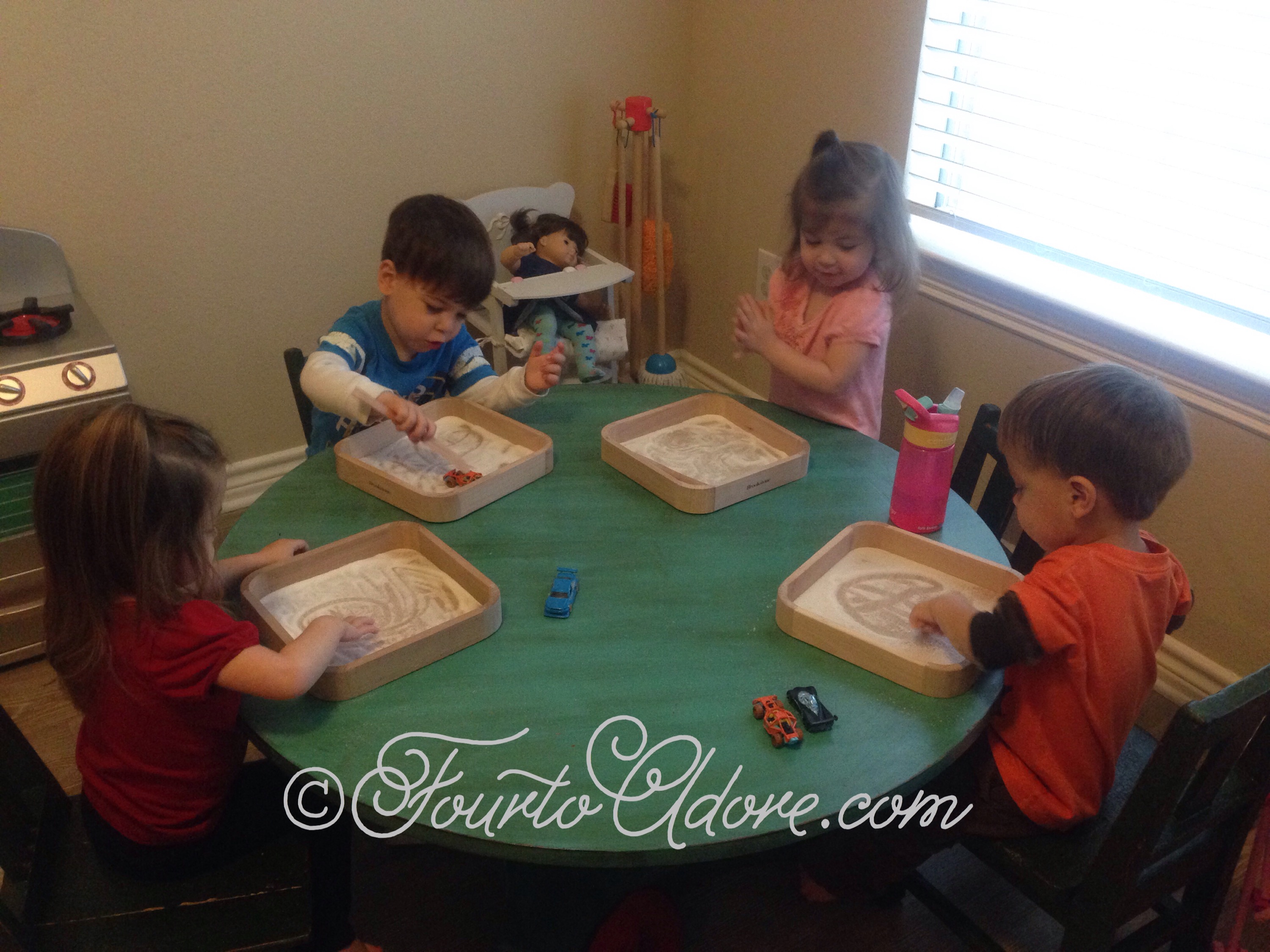 Pour a little salt onto trays and let kids trace designs or make tracks in it