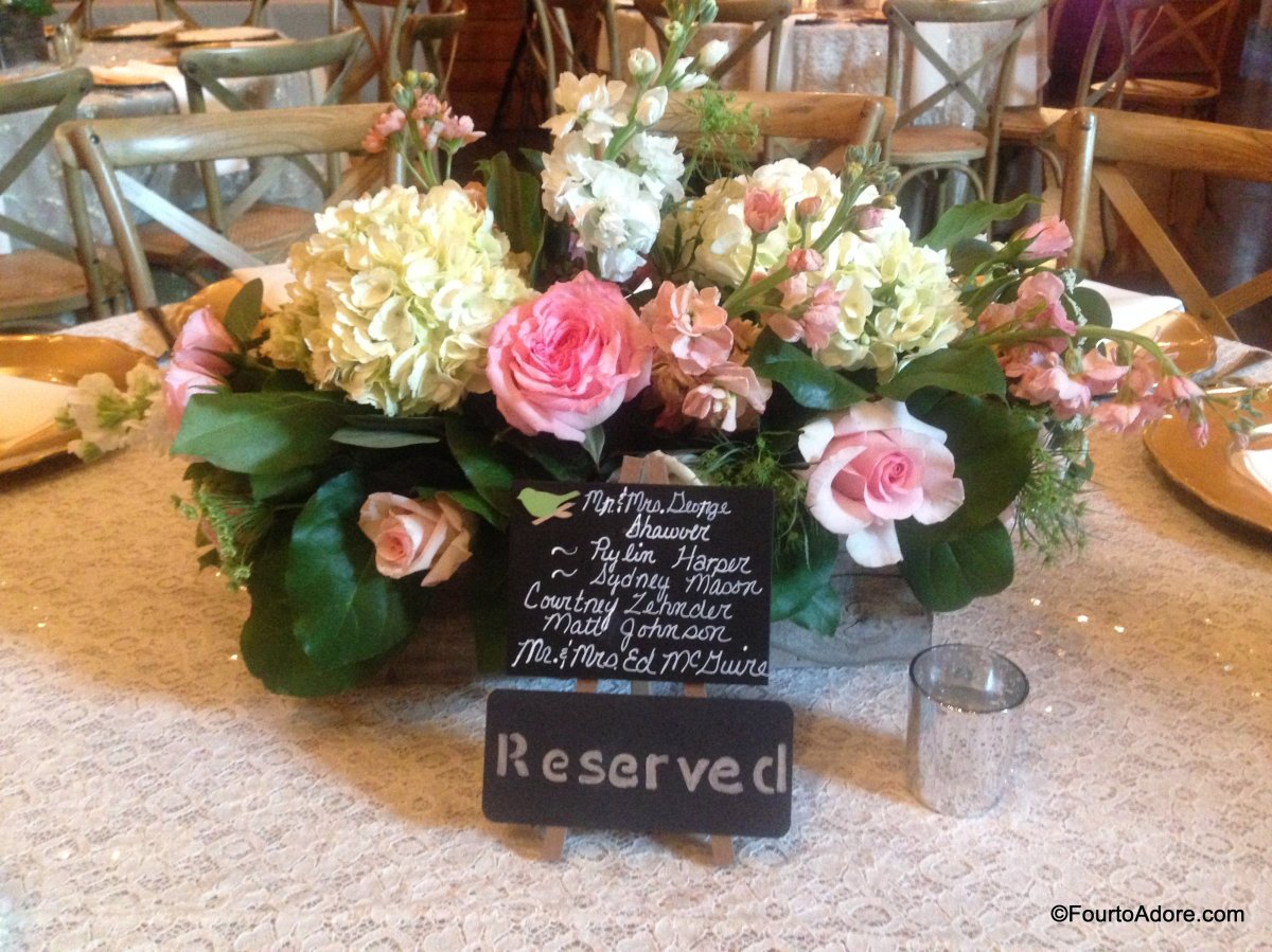 reserved seating signs and flower arrangement
